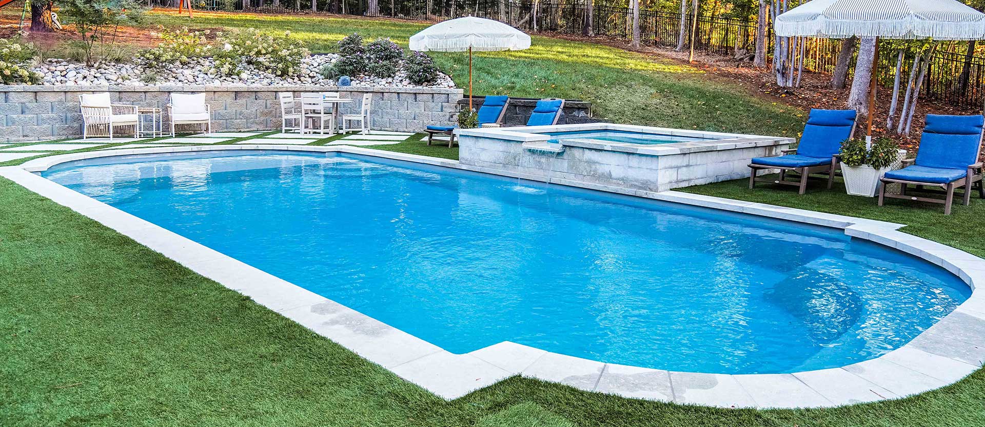 Image of a classic rectangular fiberglass pool with rounded corners and entry steps